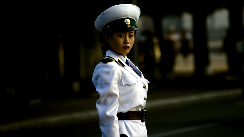 North Korean traffic officer in white uniform