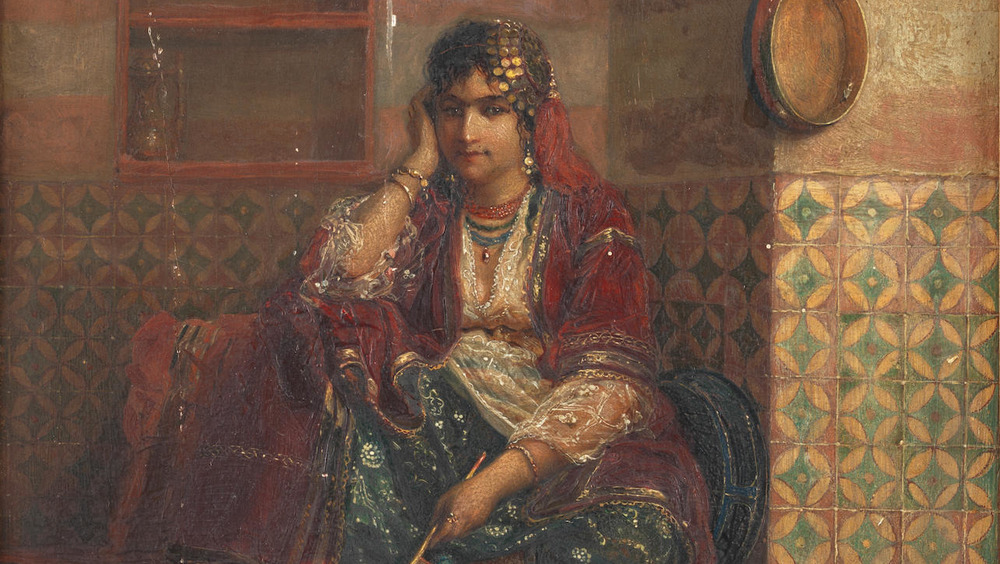 woman sitting in corner of harem
