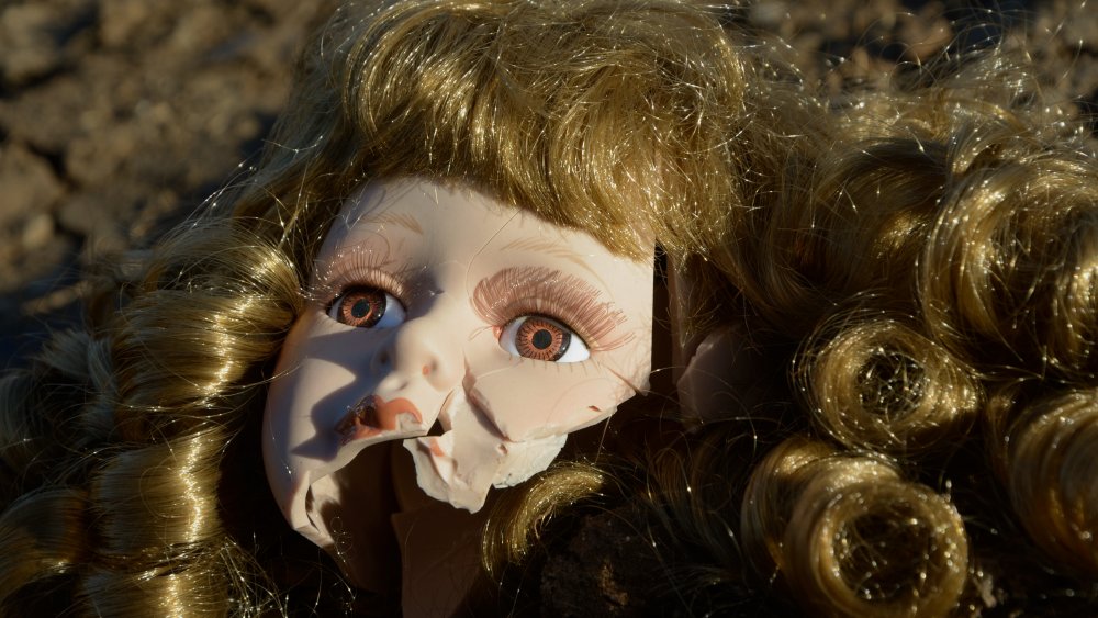 Broken doll head