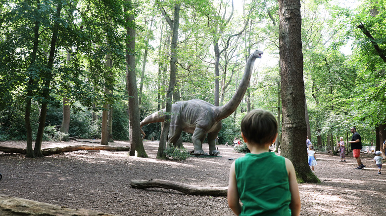 boy and dinosaur statue