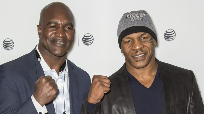 mike tyson and evander holyfield smiling