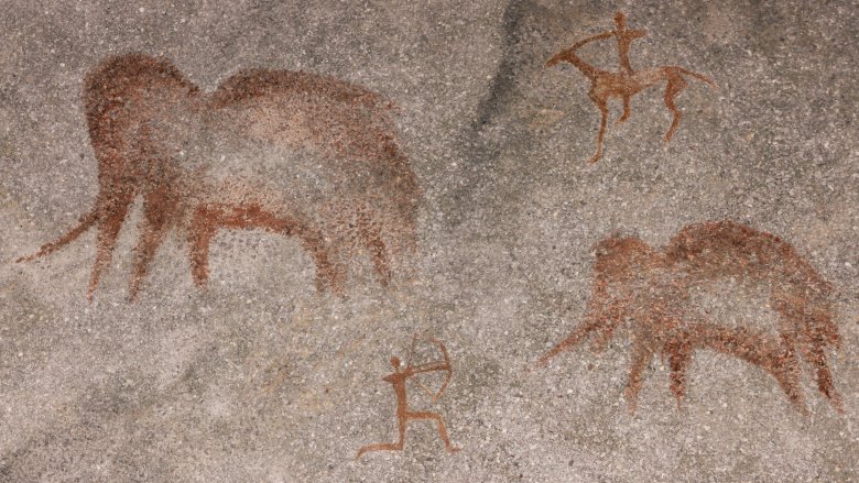 Humans hunting mammoth
