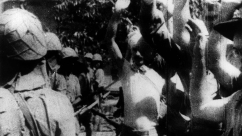 Bataan POWs holding arms in the air