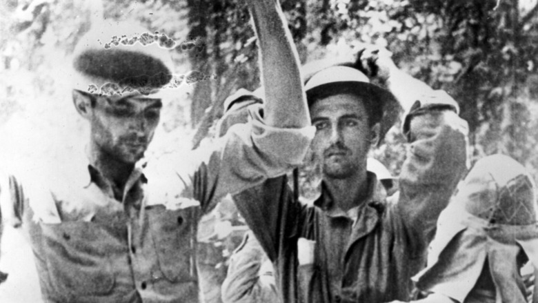 soldiers searching POWs
