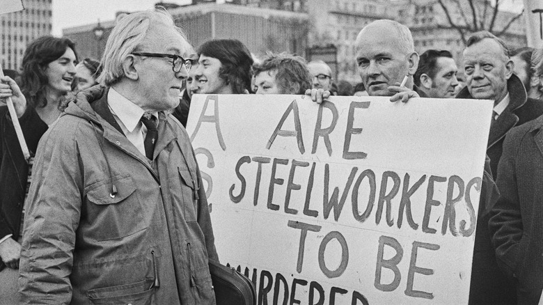 steel worker with picket sign