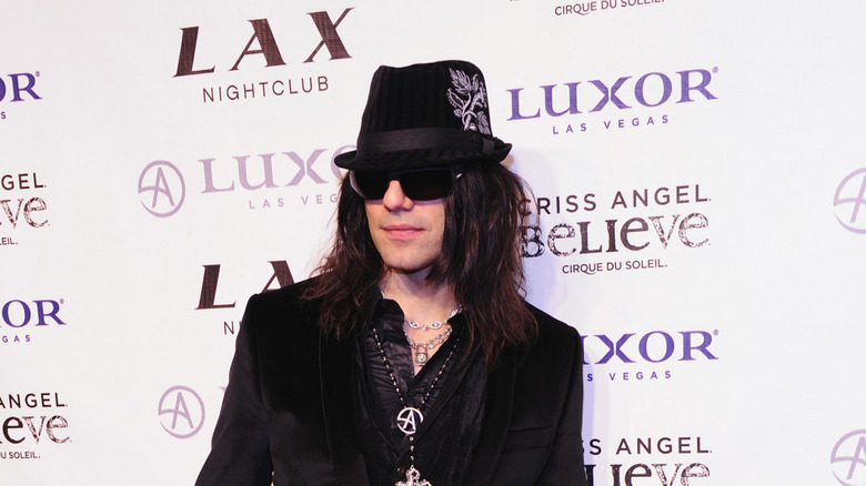 Criss Angel at Criss Angel Believe live event hat and sunglasses