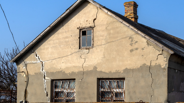 house with cracked exterior walls