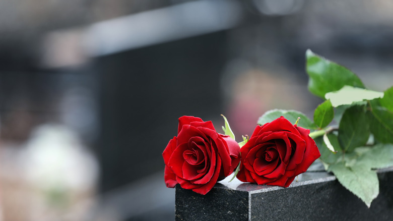 Headstone with roses on top