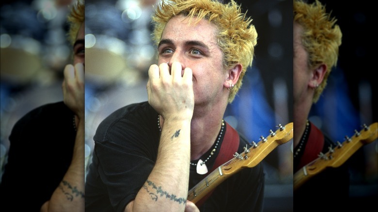 Billie Joe Armstrong covering mouth