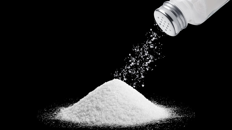 Table salt poured from container