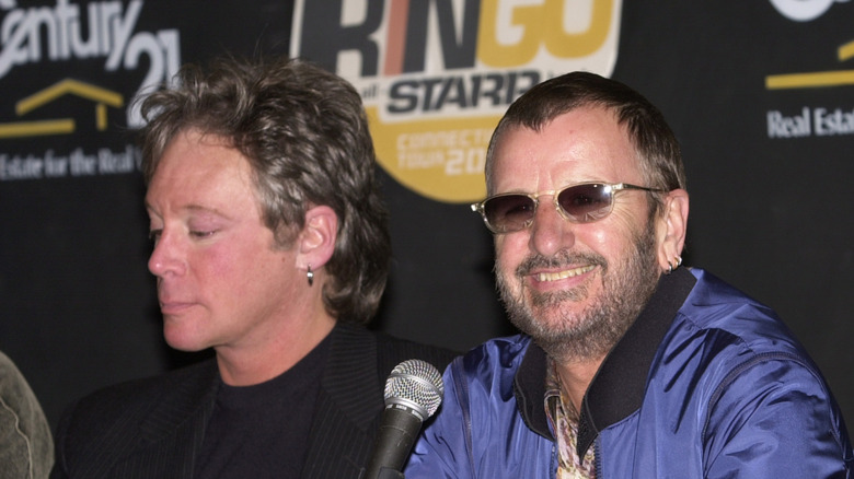 Eric Carmen at a press conference seated next to Ringo Starr