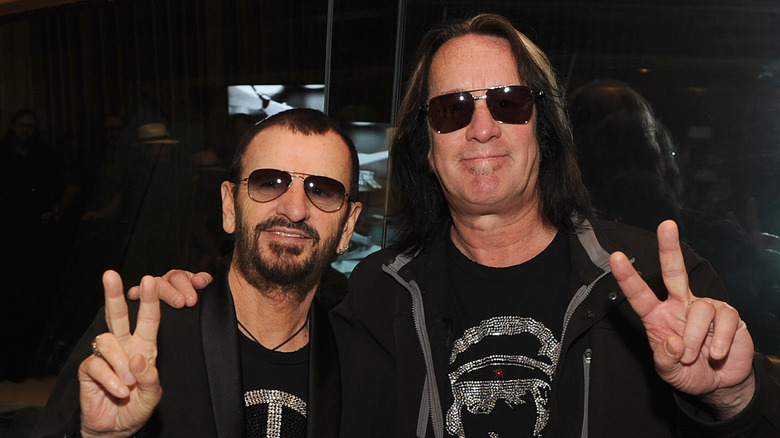 Ringo Starr and Todd Rundgren flashing the peace sign