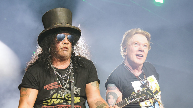 Slash and Axl Rose performing onstage