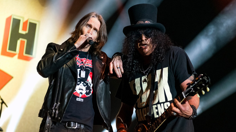 Myles Kennedy and Slash perform on stage