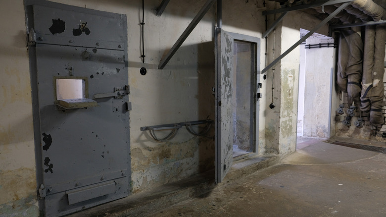 Two solitary confinement cells in a hallway