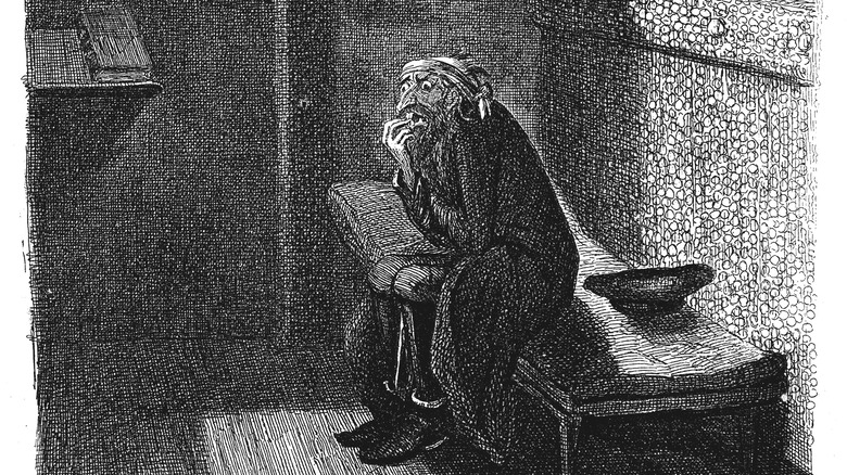 prisoner biting his nails in his cell