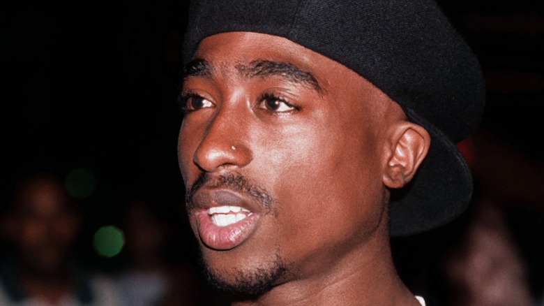 Tupac Shakur in black knit hat