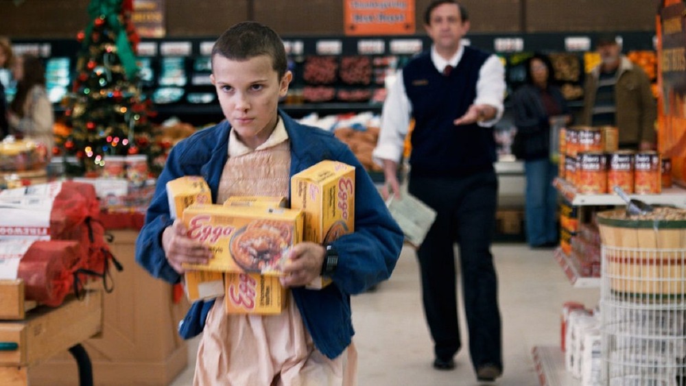 Eleven taking her Eggos.