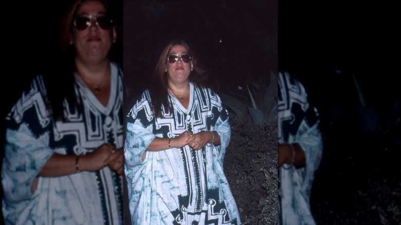 Cass Elliot in sunglasses at night