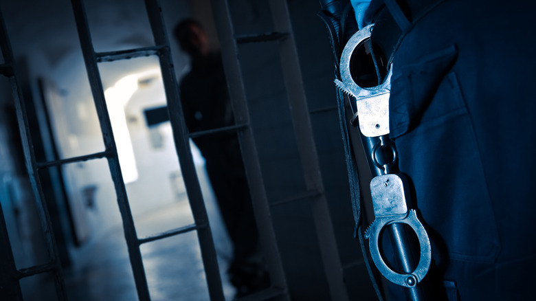 handcuffs closed jail cell