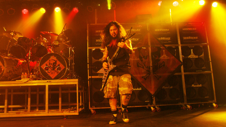 Dimebag Darrell playing guitar onstage