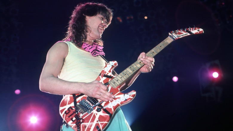 Eddie Van Halen playing guitar onstage