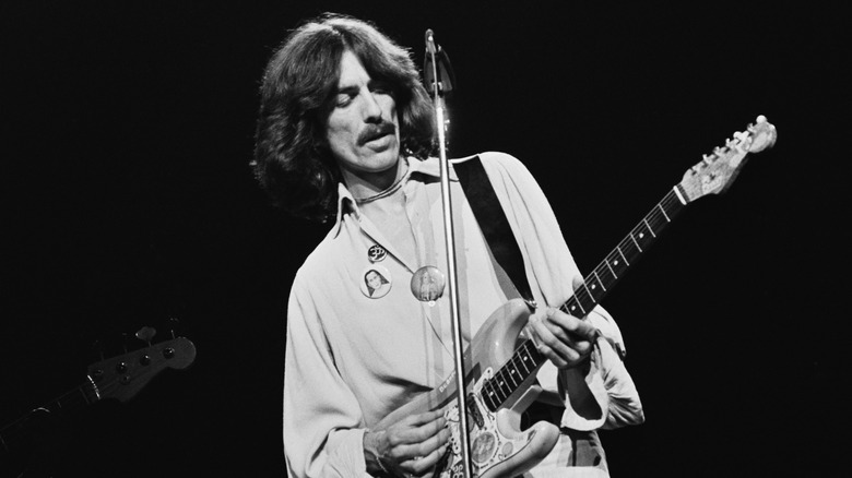 George Harrison playing guitar