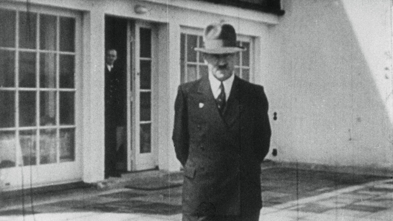 Adolf Hitler standing on a porch