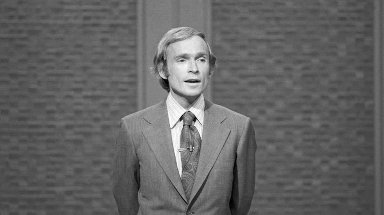 Dick Cavett speaking on the set of his TV show