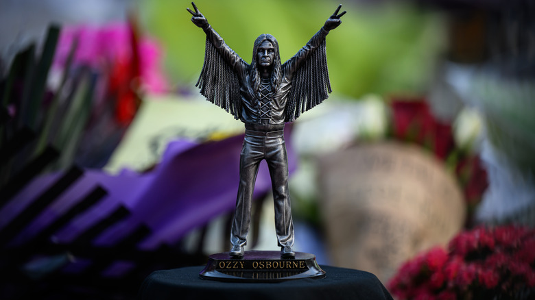 A statue of Ozzy Osbourne left at his memorial in 2025