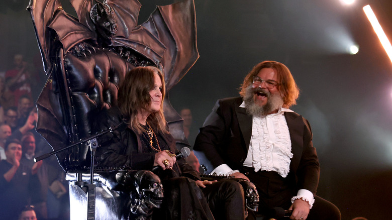 Jack Black smiling at Ozzy Osbourne at the Rock & Roll Hall of Fame 2024