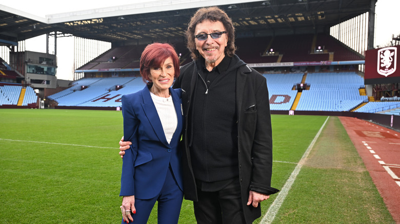 Sharon Osbourne posing with Tony Iommi at Villa Park in 2025