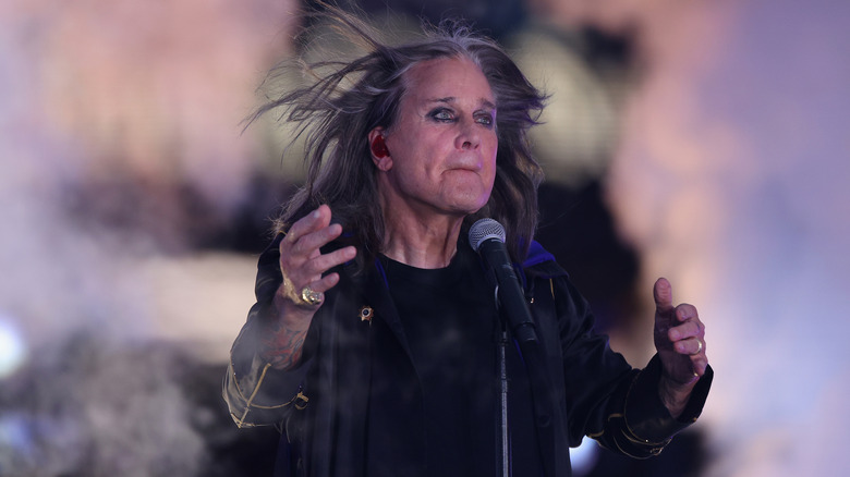 Ozzy Osbourne singing on stage in 2022