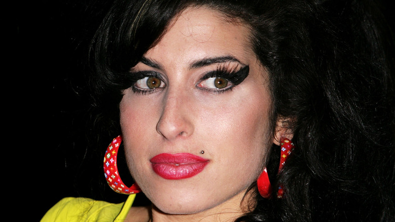 Amy Winehouse wearing red lipstick