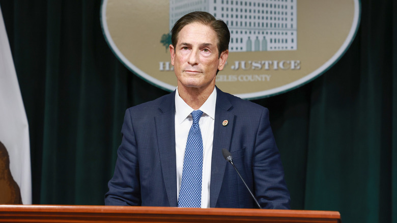 nathan hochman in suit at podium