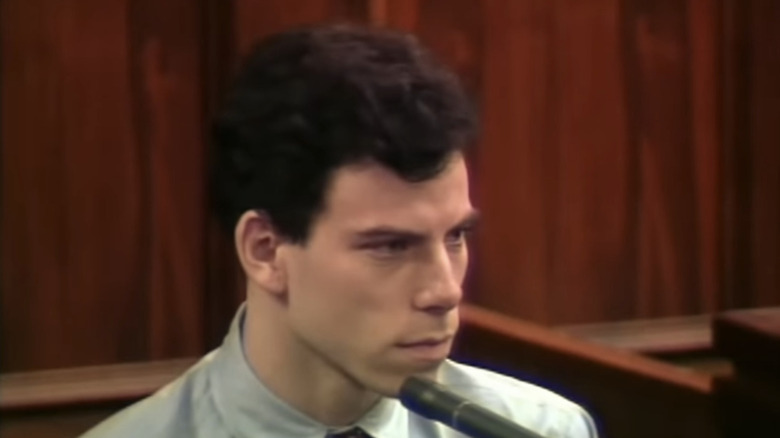 Close up Erik Menendez face with microphone