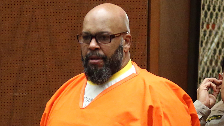 Suge Knight in orange prison jumpsuit