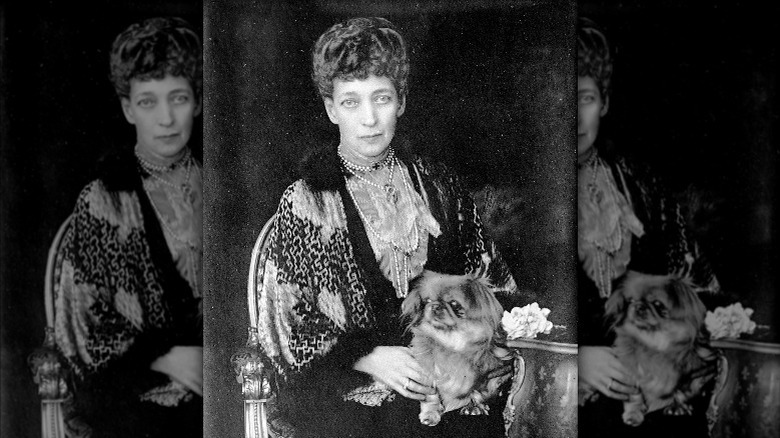 Alexandra of Denmark, Queen Consort to Edward VII of the United Kingdom with a dog in 1923