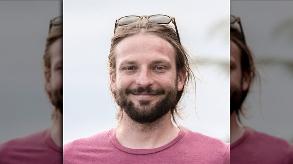 Blaine Cook headshot photo with glasses on head