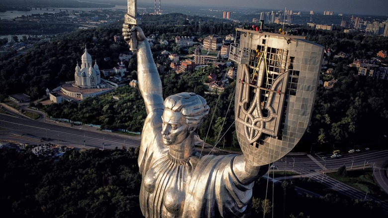 Motherland statue in Kyiv with trident coat of arms