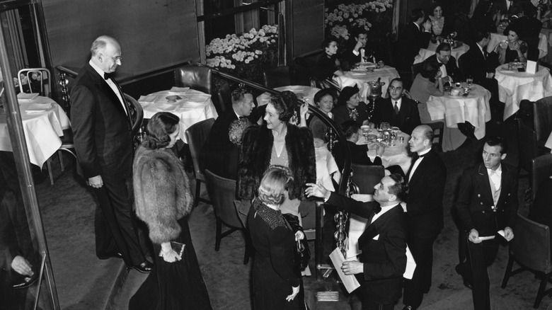 Guests arrive standing maitre d 