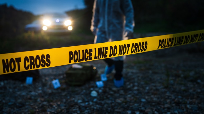 crime scene tape investigator car