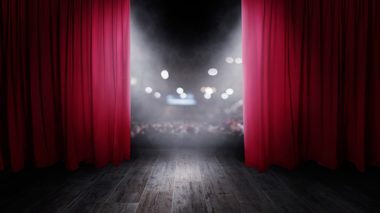 Through the stage curtains