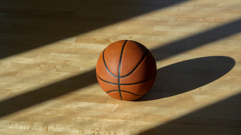 Photo of a basketball in court