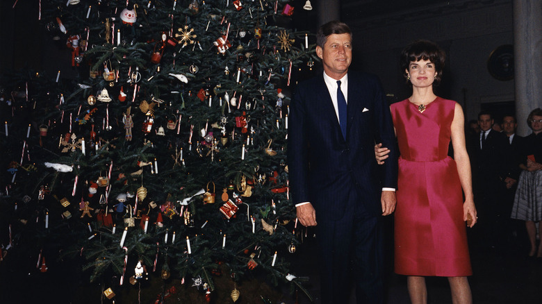 John F. Kennedy and Jackie in front of a Christmas tree