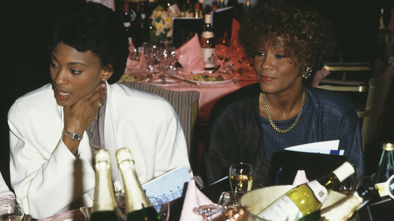 Whitney Houston, Robyn Crawford at party