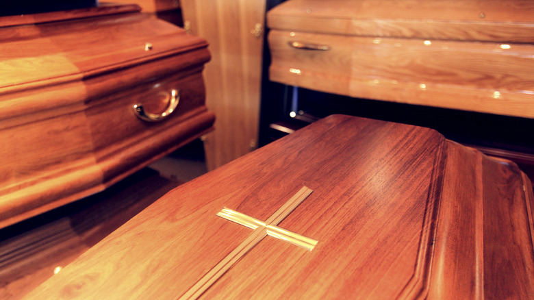Simple wooden coffin with cross