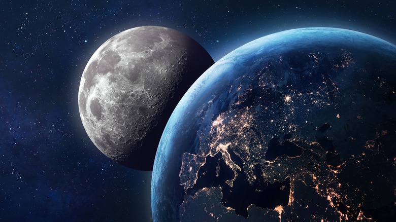 Moon peeking out behind Earth