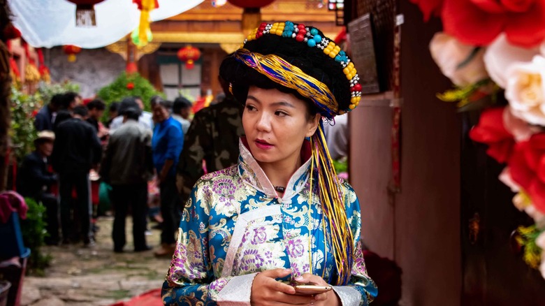 A Mosuo girl in bridesmaid clothing