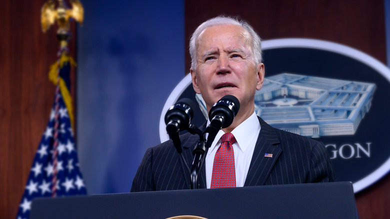 joe biden standing at podium